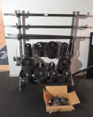 a box of screws and a bunch of bolts on the floor