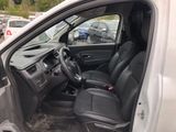a white van with black seats in a parking lot