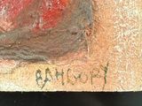 a piece of wood with a piece of red paint on it