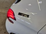 a white car with a sticker on the back of it