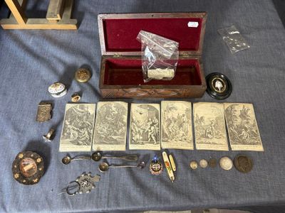 a table with a lot of antique items on it