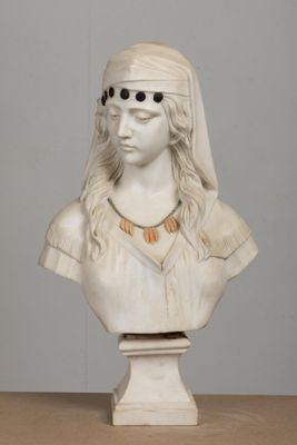 a white bust of a woman with a veil on her head