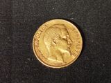 a close up of a coin on a black surface