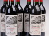 six bottles of red wine are lined up in a row