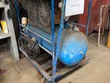 a blue cart with a blue ball on it in a garage