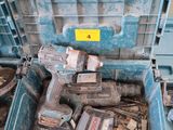 a blue tool box with tools in it sitting on the floor