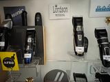 many different types of hair clippers on display in a store