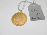 a close up of a coin with a price tag attached to it
