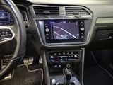 the interior of a car with a steering wheel and dashboard controls