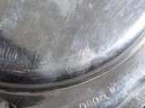a silver plate with a handle on a table