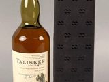the bottle of talisker is next to a black box