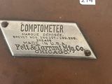 an old machine with a metal plaque on the side of it