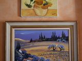 painting of sunflowers in a vase and a painting of lavenders in a vase