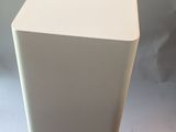 a white vase that is sitting on a table