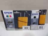 two boxes of epson ink cartridges are sitting next to each other