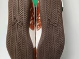 nike air force 1 ' s in brown and white with a green box