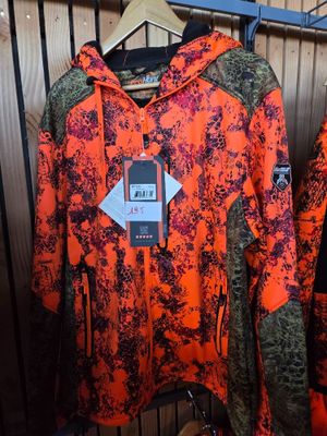 two jackets hanging on a rack in a store