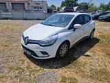 a white car parked in a lot with a lot of cars in the background
