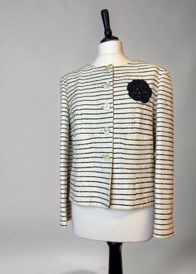 a white and black striped jacket on a mannequin mannequin mannequin mannequin mannequin mannequin mannequin mannequin
