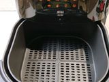an air fryer that is sitting on a counter