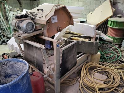 a machine that is sitting in the middle of a pile of junk