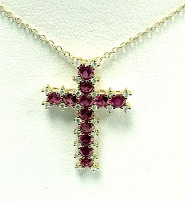 une image représentant un collier orné d'une croix composée de pierres rouges