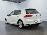 the back of a white volkswagen e - golf parked in a garage