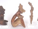 several pieces of art are displayed on display on a white surface