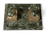 two marble candles on a marble stand