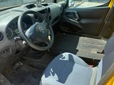 a small yellow car with a steering wheel and a dashboard