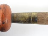 a close up of a baseball bat with a wooden handle