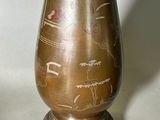 two vases that are sitting on a table