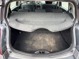 a trunk of a car with the back seats folded down