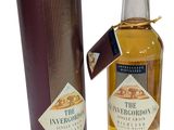 an image of a bottle of whisky next to a cardboard box