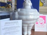 a picture of an inflatable statue of a man on a table