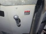 an image of a dirty gas furnace in a garage