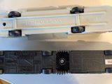 two toy trains that are sitting next to each other