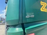 a green truck with a yellow z logo on the side
