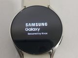 a smart watch with the samsung logo displayed on the screen