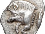 a close up of a silver coin with a horse on it