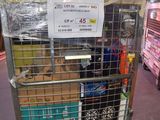 a metal cart with a sign on top of it in a warehouse