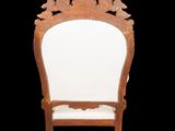 an image of a wooden chair with white upholstered seat