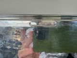 a metal box with a picture of a man and a woman inside of it