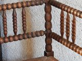 a wooden chair with a wooden seat and a wooden back rest