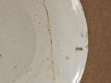 a white plate that has a hole in it