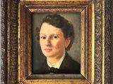 portrait d'un jeune garçon en costume noir et nœud papillon