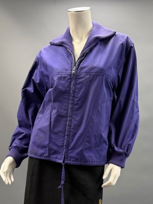 an image of a mannequin wearing a purple jacket and black skirt