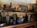 a shelf with many bottles and jars on it