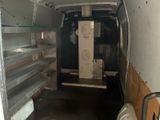 a white van that is parked inside of a building