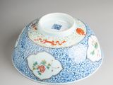 a blue and white bowl sitting on a table